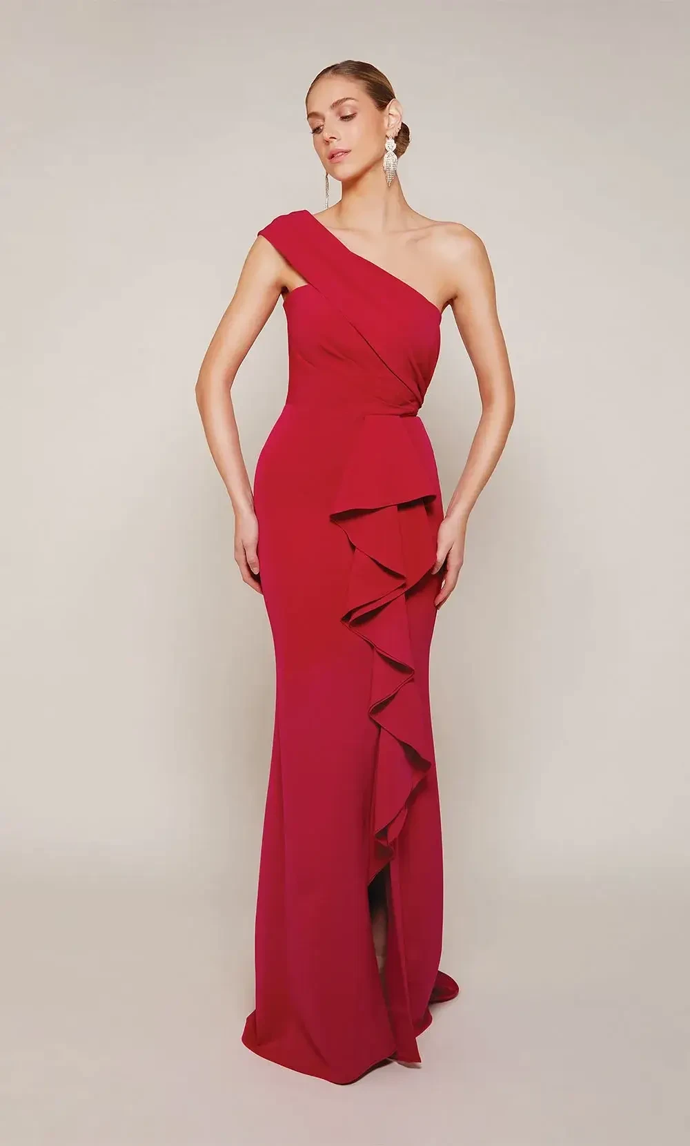 model is wearing a red one shoulder mothers gown