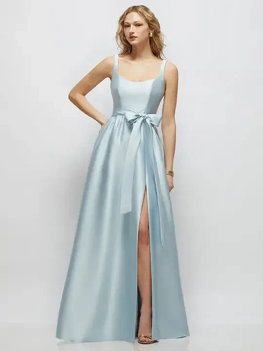 model is wearing a sleeveless light blue bridesmaid dress