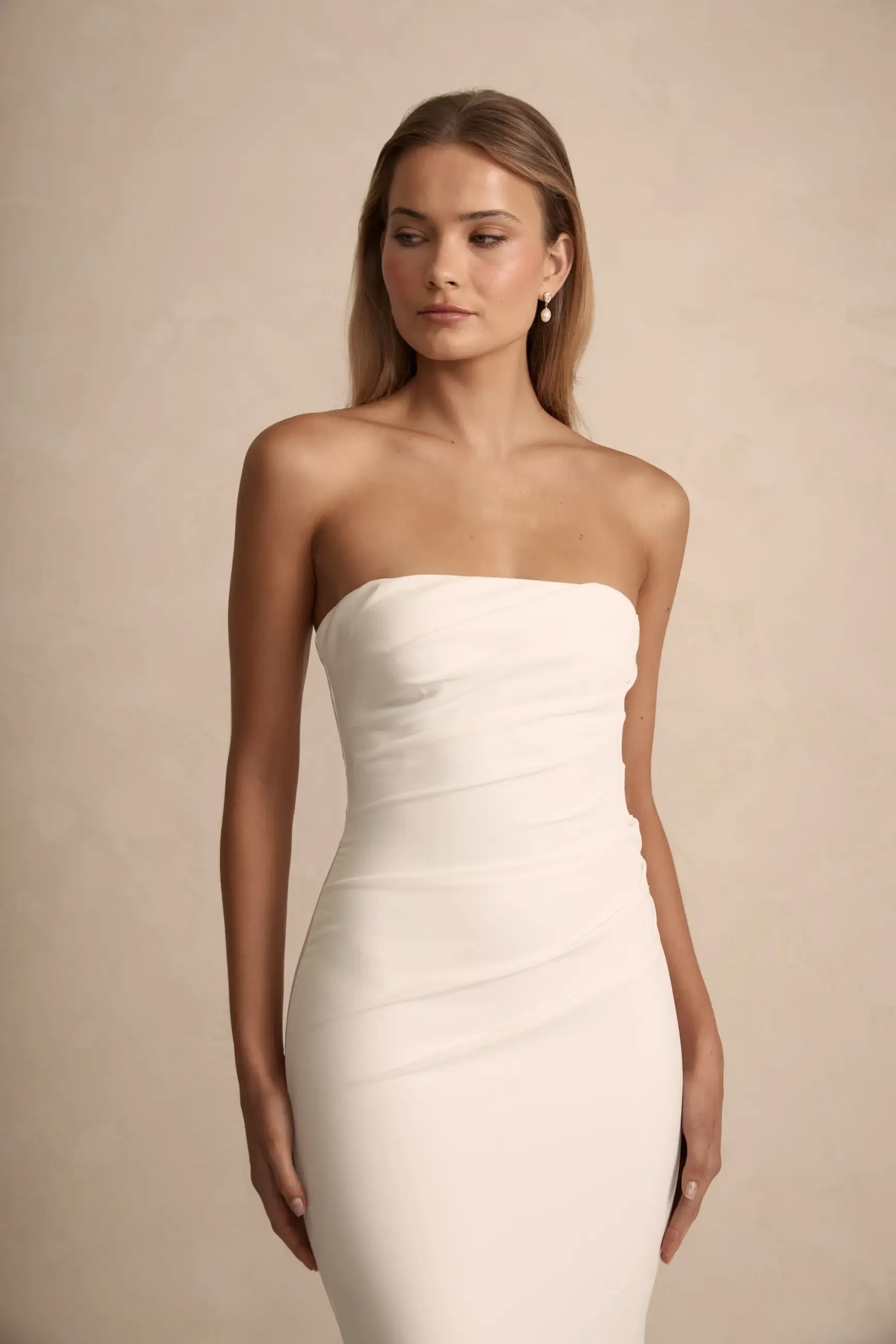 model is wearing a strapless bridal gown